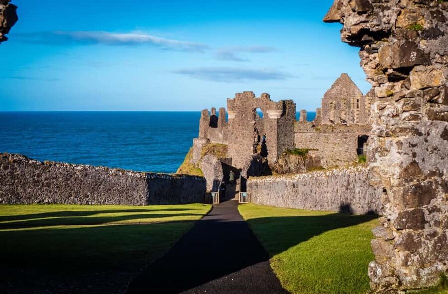 Belfast: Giant's Causeway & Irish Castles Tour -WIFI onboard - Carrickfergus Castle and the first taste of the coast