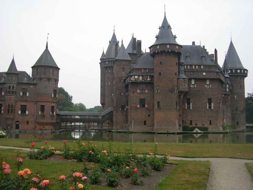 From Amsterdam: Private Day Trip to the Dutch Castles - Entering Muiden Castle by drawbridge