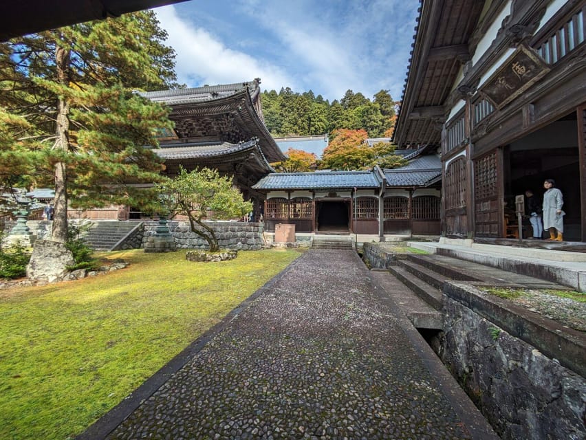 From Kanazawa: Eiheiji Buddhist Temple & Fukui Castle Town - Eiheiji: cedar trees, Zen buildings, and working monks