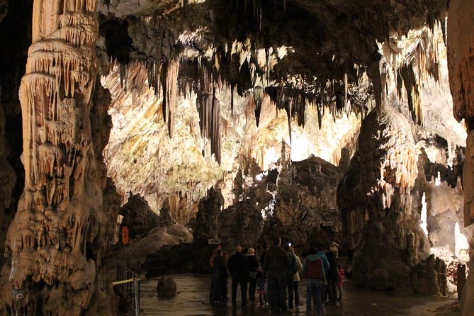 From Zagreb: POSTOJNA cave + Predjama castle + LJUBLJANA Day Tour - Entering Postojna Cave by underground train