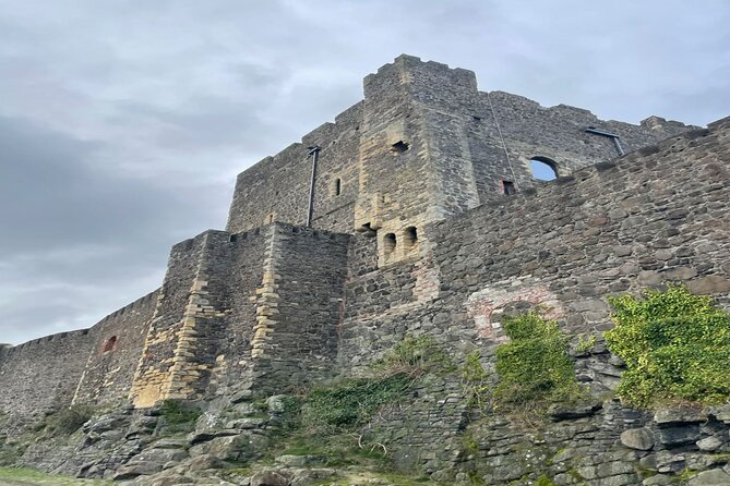 Giants Causeway, Rope Bridge, Carrickfergus Castle and Dark Hedges Tour - Walking across the Giant’s Causeway