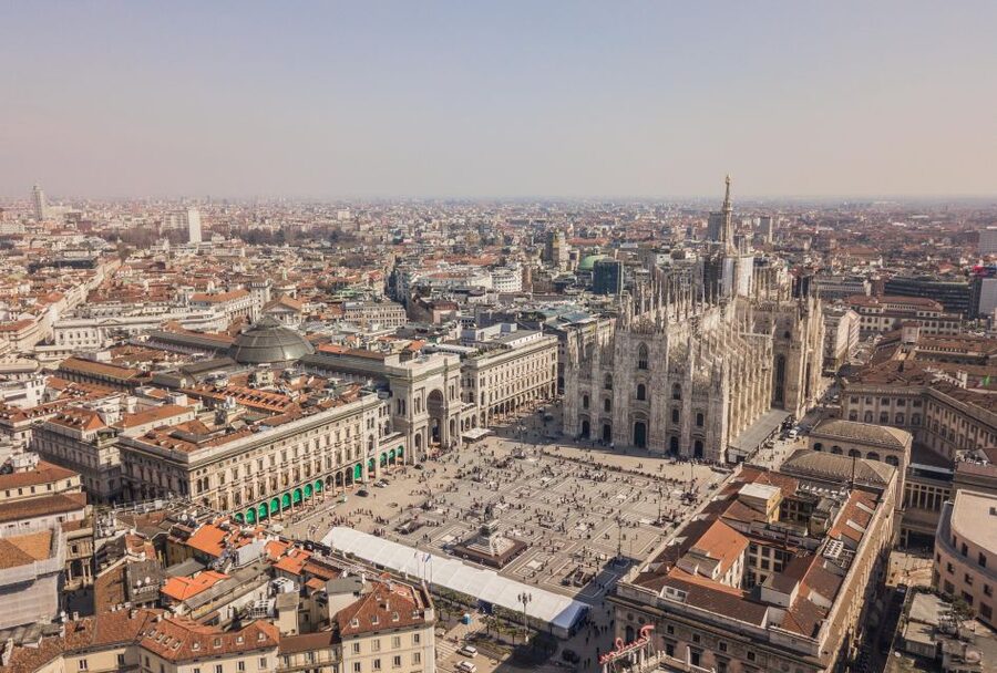 Milan Small Group: Duomo & Rooftop, Castle, Gelato Tasting - Walking through central Milan