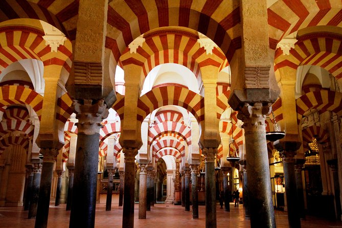 Mosque-Cathedral, Alcazar & Jewish Quarter with Tickets - The Roman Bridge sets the scene