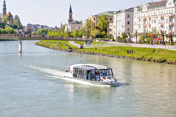 Mozart Concert and Dinner or VIP Dinner at Fortress Salzburg with River Cruise - Walking from the dock to the fortress funicular