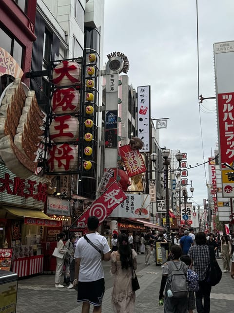 Osaka: 1-Day Guided Tour - Sky Bldg, Castle, Namba Shinsekai - Dotonbori: neon, street food, and the Glico sign
