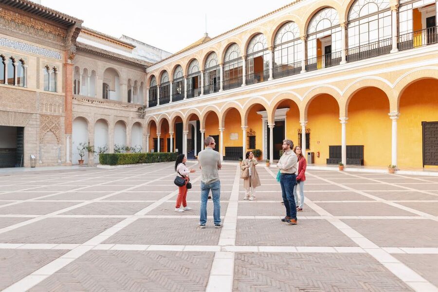 Seville: Guided Walking Tour with Alcazar & Cathedral Access - What the guide adds to the morning